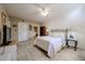 Spacious bedroom with a king-size bed and en-suite bathroom access at 10330 W Thunderbird Blvd # A321, Sun City, AZ 85351