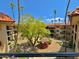 Community courtyard with lush landscaping, gazebo, and walking paths at 10330 W Thunderbird Blvd # A321, Sun City, AZ 85351