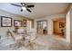 Bright dining area featuring a glass table and four chairs at 10330 W Thunderbird Blvd # A321, Sun City, AZ 85351