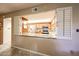 View of kitchen from dining area pass-through at 10330 W Thunderbird Blvd # A321, Sun City, AZ 85351