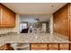 Kitchen pass-through to dining area with granite counter at 10330 W Thunderbird Blvd # A321, Sun City, AZ 85351