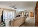 Living room with sliding doors that lead to the outdoor balcony at 10330 W Thunderbird Blvd # A321, Sun City, AZ 85351