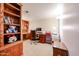 Home office with built-in wooden shelves and desk at 10330 W Thunderbird Blvd # A321, Sun City, AZ 85351