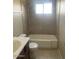 Bathroom with tub, toilet and vanity at 10365 W Pinehurst Dr, Sun City, AZ 85351