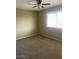 Bedroom with ceiling fan and large window at 10365 W Pinehurst Dr, Sun City, AZ 85351