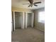 Spacious bedroom with double closets and ceiling fan at 10365 W Pinehurst Dr, Sun City, AZ 85351