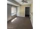 Bright living room with patio door and closet at 10365 W Pinehurst Dr, Sun City, AZ 85351