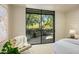 Bedroom with sliding glass doors opening to patio at 10531 E Fernwood Ln, Scottsdale, AZ 85262