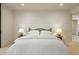 Serene bedroom with white bedding and modern decor at 10531 E Fernwood Ln, Scottsdale, AZ 85262