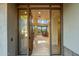 Open entryway with glass doors leading into the home at 10531 E Fernwood Ln, Scottsdale, AZ 85262