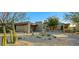 Contemporary home with desert landscaping and a two-car garage at 10531 E Fernwood Ln, Scottsdale, AZ 85262