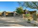 Modern home with clean lines and a spacious driveway at 10531 E Fernwood Ln, Scottsdale, AZ 85262