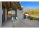 Private patio with modern chairs and sliding door access at 10531 E Fernwood Ln, Scottsdale, AZ 85262