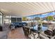 Screened patio with seating area and dining table at 10531 W Prairie Hills Cir, Sun City, AZ 85351