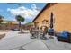 Outdoor patio furniture near a refreshing pool and lush landscaping at 11259 W Harrison St, Avondale, AZ 85323