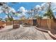 Brick paved backyard patio with a wishing well and seating at 11259 W Harrison St, Avondale, AZ 85323