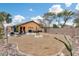 Large backyard with firepit and landscaping, perfect for relaxation at 11259 W Harrison St, Avondale, AZ 85323