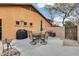 Relaxing backyard patio with seating area, grill, and shade umbrella at 11259 W Harrison St, Avondale, AZ 85323