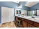 Elegant bathroom with double sinks, a large shower, and a soaking tub at 11259 W Harrison St, Avondale, AZ 85323