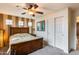 Bedroom with wood furniture, large window and carpet at 11259 W Harrison St, Avondale, AZ 85323