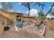 Brick paved courtyard with seating area and wishing well at 11259 W Harrison St, Avondale, AZ 85323