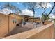 Landscaped courtyard with brick pavers, seating, and a water feature at 11259 W Harrison St, Avondale, AZ 85323