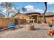 Inviting front patio with brick paving, a central water feature, and seating at 11259 W Harrison St, Avondale, AZ 85323