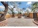 Relaxing front patio with brick paving, a water feature, and desert plants at 11259 W Harrison St, Avondale, AZ 85323