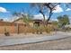 Front yard with cacti, agave, and a stucco wall at 11259 W Harrison St, Avondale, AZ 85323