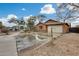 Single-story house with a clean and modern look, featuring a driveway and landscaping at 11259 W Harrison St, Avondale, AZ 85323