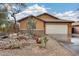 House with a desert front yard, featuring gravel, cacti, and a decorative pot at 11259 W Harrison St, Avondale, AZ 85323