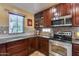 Kitchen with stainless steel appliances and wood cabinets at 11259 W Harrison St, Avondale, AZ 85323