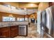 Modern kitchen with stainless steel appliances and view to living area at 11259 W Harrison St, Avondale, AZ 85323