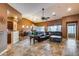 Spacious living room with a leather sectional sofa and tile floors at 11259 W Harrison St, Avondale, AZ 85323