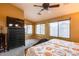 Main bedroom with large windows, a dresser, and a king-size bed at 11259 W Harrison St, Avondale, AZ 85323