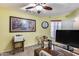 Home office with wood desk and carpet at 11259 W Harrison St, Avondale, AZ 85323