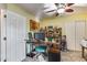 Home office with wood desk and carpet at 11259 W Harrison St, Avondale, AZ 85323