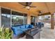 Covered patio with comfortable seating and ceiling fans at 11259 W Harrison St, Avondale, AZ 85323