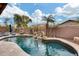 Relaxing kidney-shaped pool with waterfall feature at 11259 W Harrison St, Avondale, AZ 85323