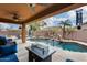 Inviting pool with waterfall feature and spacious patio at 11259 W Harrison St, Avondale, AZ 85323