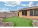 Putting green and backyard view at 11259 W Harrison St, Avondale, AZ 85323