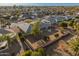 An aerial view showcasing a house with a large backyard, and surrounding neighborhood at 12734 W Crystal Lake Dr, Sun City West, AZ 85375