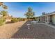 Backyard view with gravel, a birdbath, and seating at 12734 W Crystal Lake Dr, Sun City West, AZ 85375