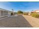 Backyard with gravel and a view of neighboring homes at 12734 W Crystal Lake Dr, Sun City West, AZ 85375