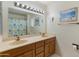 Updated bathroom with a double vanity and shower/tub combo at 12734 W Crystal Lake Dr, Sun City West, AZ 85375