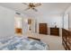 Main bedroom with ensuite access, walk-in closet, and ceiling fan at 12734 W Crystal Lake Dr, Sun City West, AZ 85375