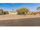 Single story home with a light green exterior and desert landscaping, offering curb appeal at 12734 W Crystal Lake Dr, Sun City West, AZ 85375