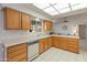 Bright kitchen with wood cabinets, ample counter space, and modern appliances at 12734 W Crystal Lake Dr, Sun City West, AZ 85375