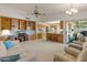 Open living area with built-in shelving and views of the kitchen at 12734 W Crystal Lake Dr, Sun City West, AZ 85375