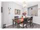 Charming dining room with dark wood table and decorative wall art at 12791 W Caraveo Pl, Peoria, AZ 85383